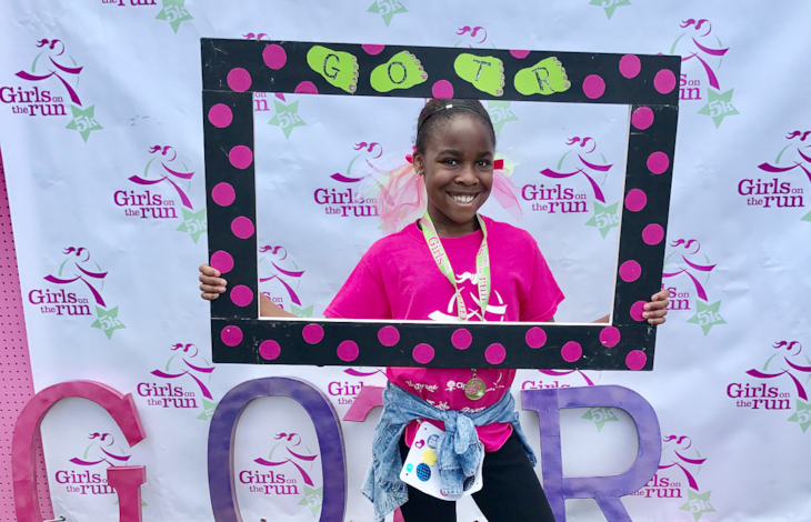 GOTR participant Kai O'Neal poses for the camera after completing her 5K Celebration.